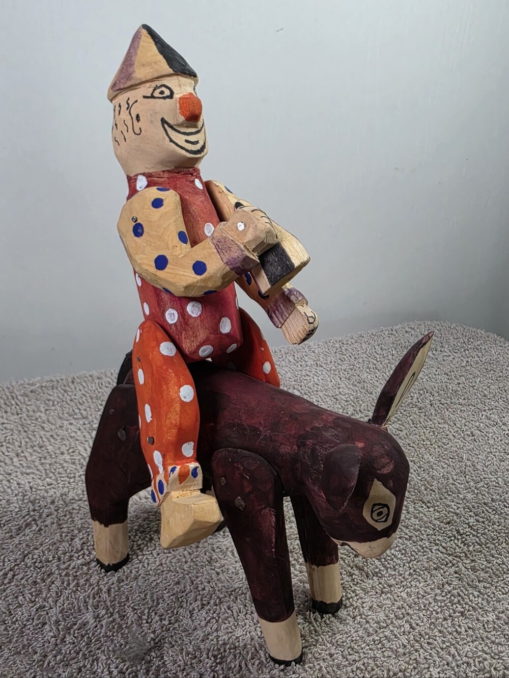 Handcrafted Polka Dot Clown Figure on Dark Brown Donkey